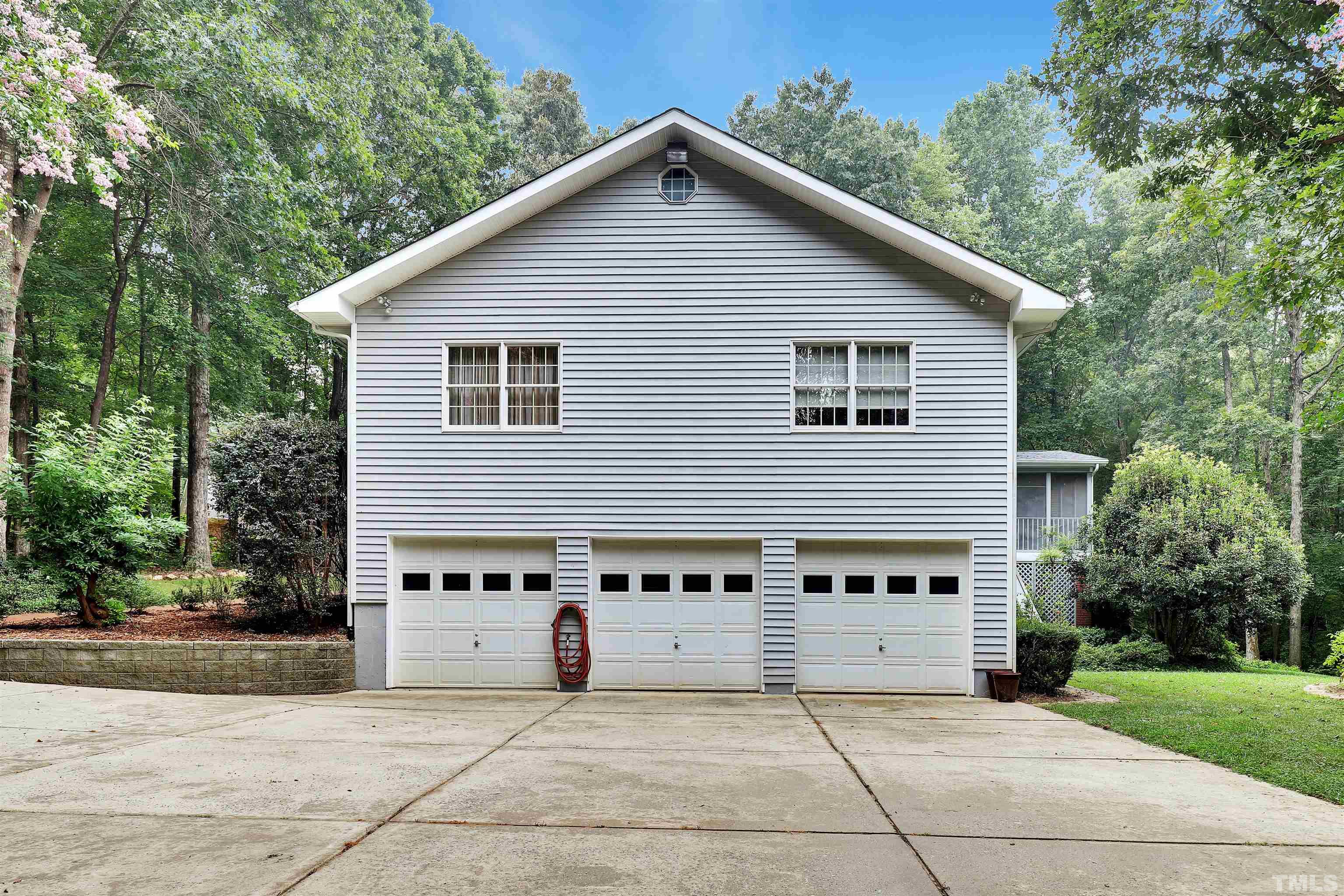 1008 Windstar Way Willow Spring, NC 27592 - Photo 48 of 51 a view of a house with a yard and potted plants