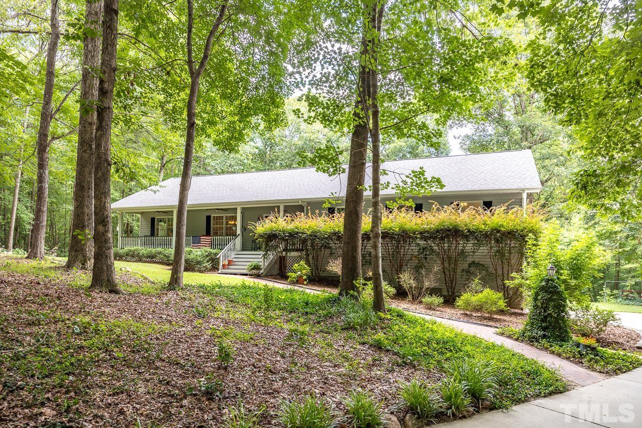 1008 Windstar Way Willow Spring, NC 27592 - Photo 51 of 51 a view of a house with backyard and a tree