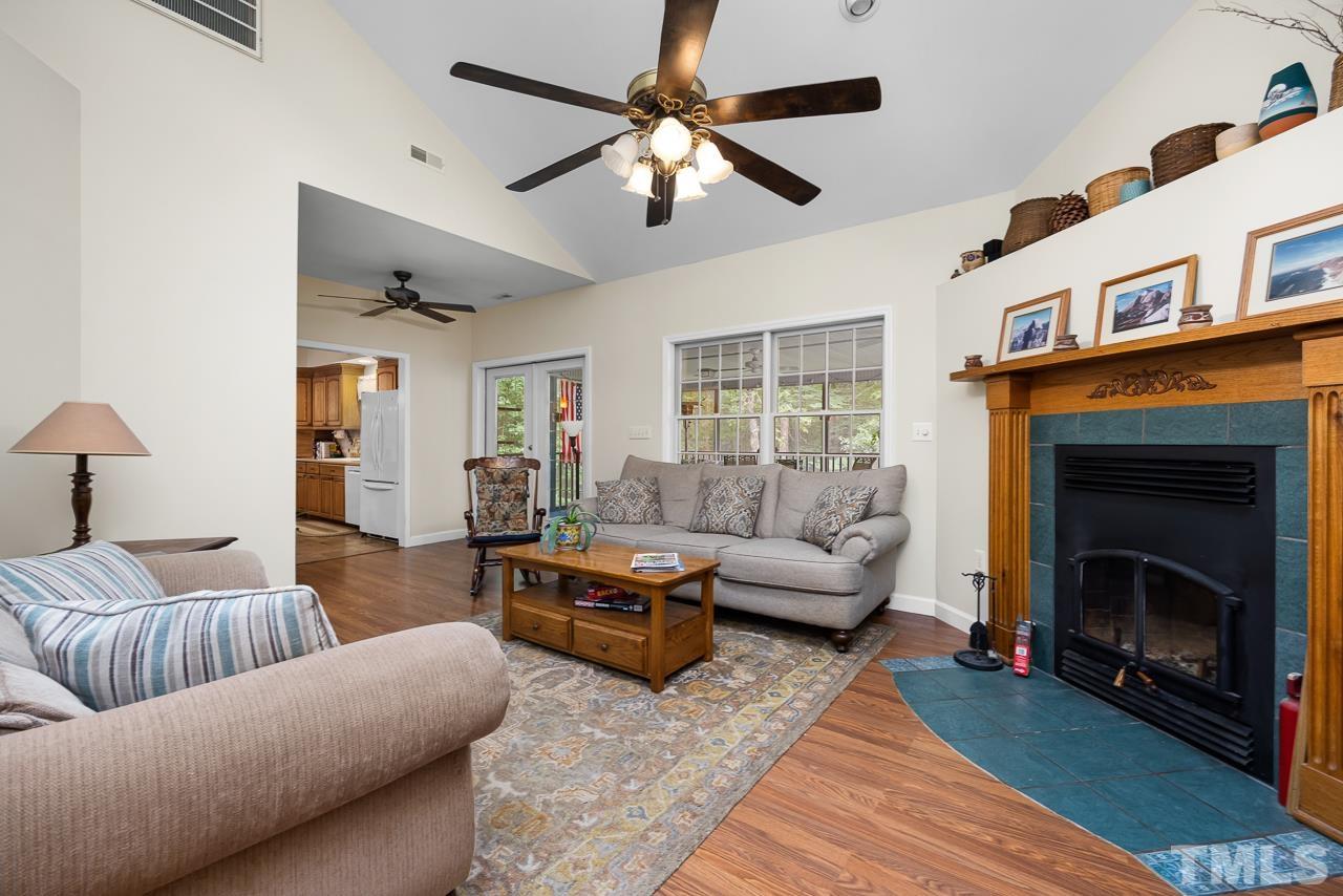 1008 Windstar Way Willow Spring, NC 27592 - Photo 6 of 51 a living room with furniture and a fireplace