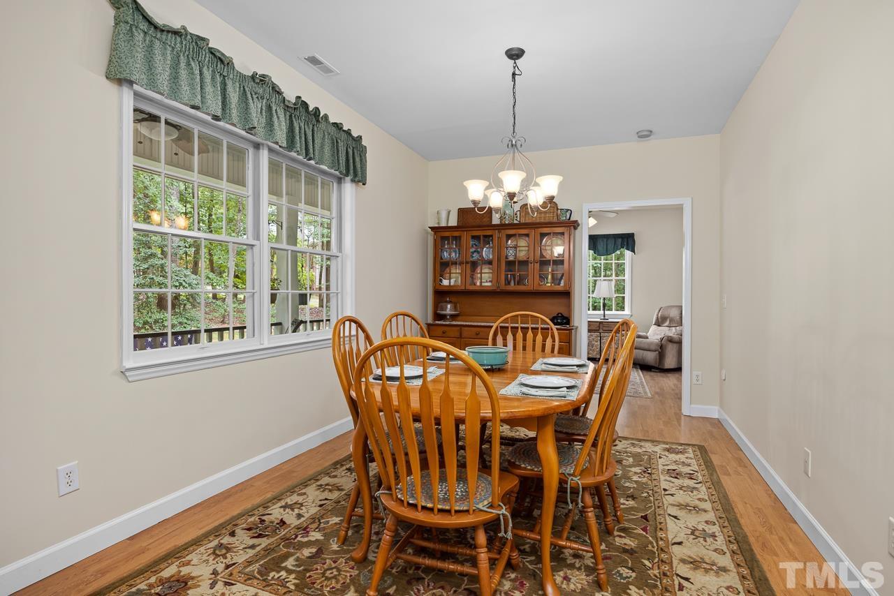 1008 Windstar Way Willow Spring, NC 27592 - Photo 10 of 51 a view of a dining room with furniture window and outside view