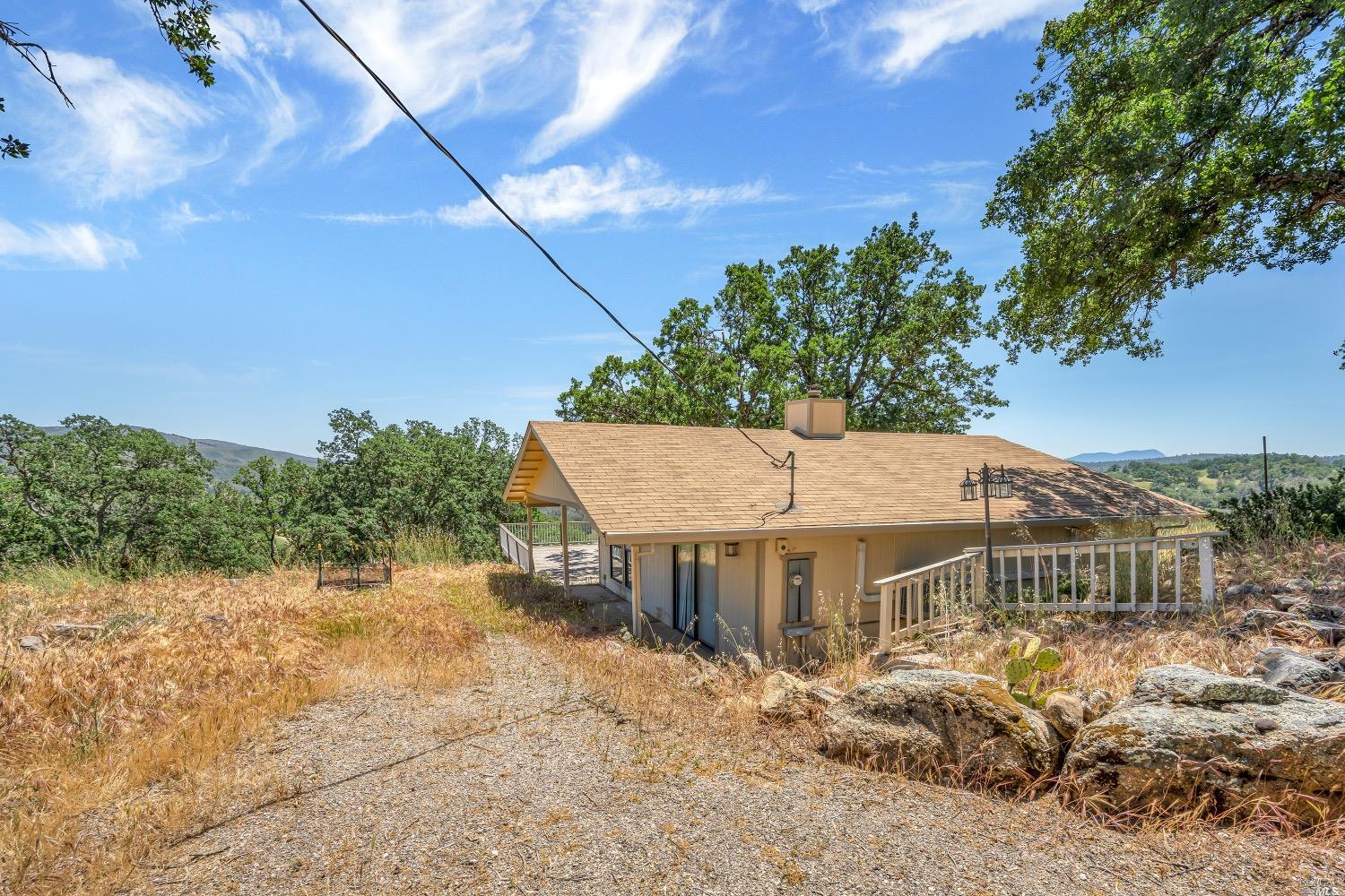 19511 Oak Haven Road Lower Lake, CA 95457 - Photo 1 of 39 a view of a big house with a big yard and large tree