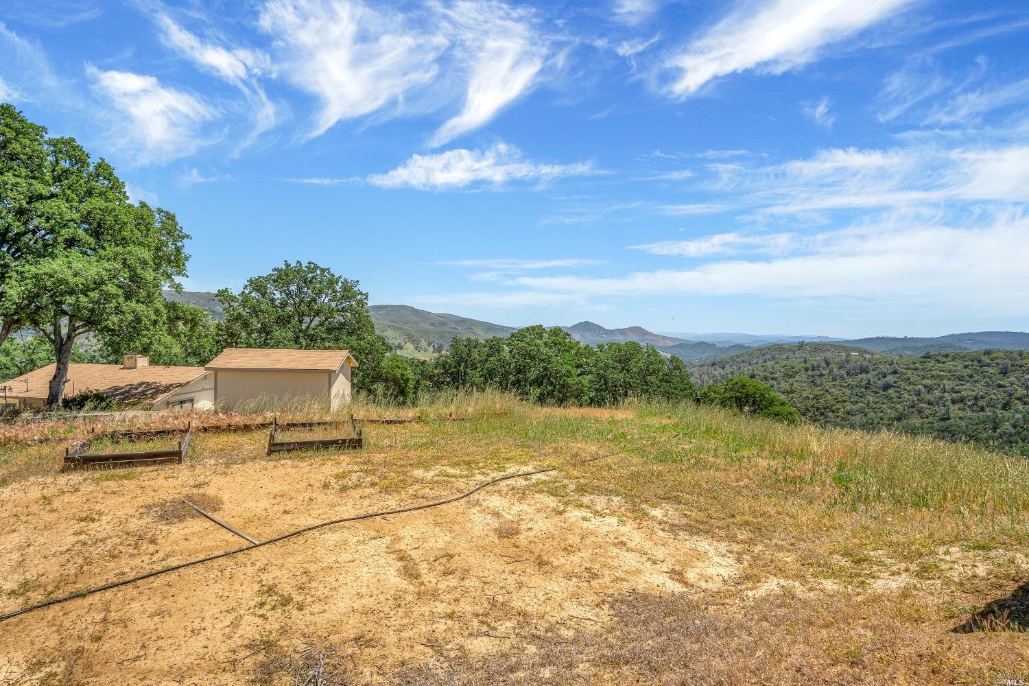 19511 Oak Haven Road Lower Lake, CA 95457 - Photo 22 of 39 a view of a lake with a yard