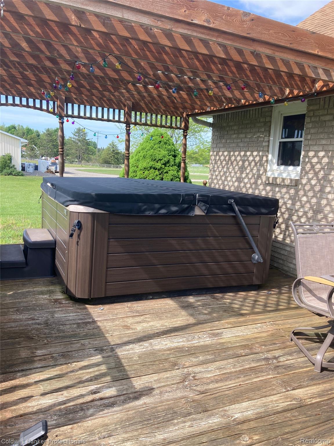 3210 South Kingston Road Kingston, MI 48741 - Photo 13 of 64 Wooden terrace with a hot tub