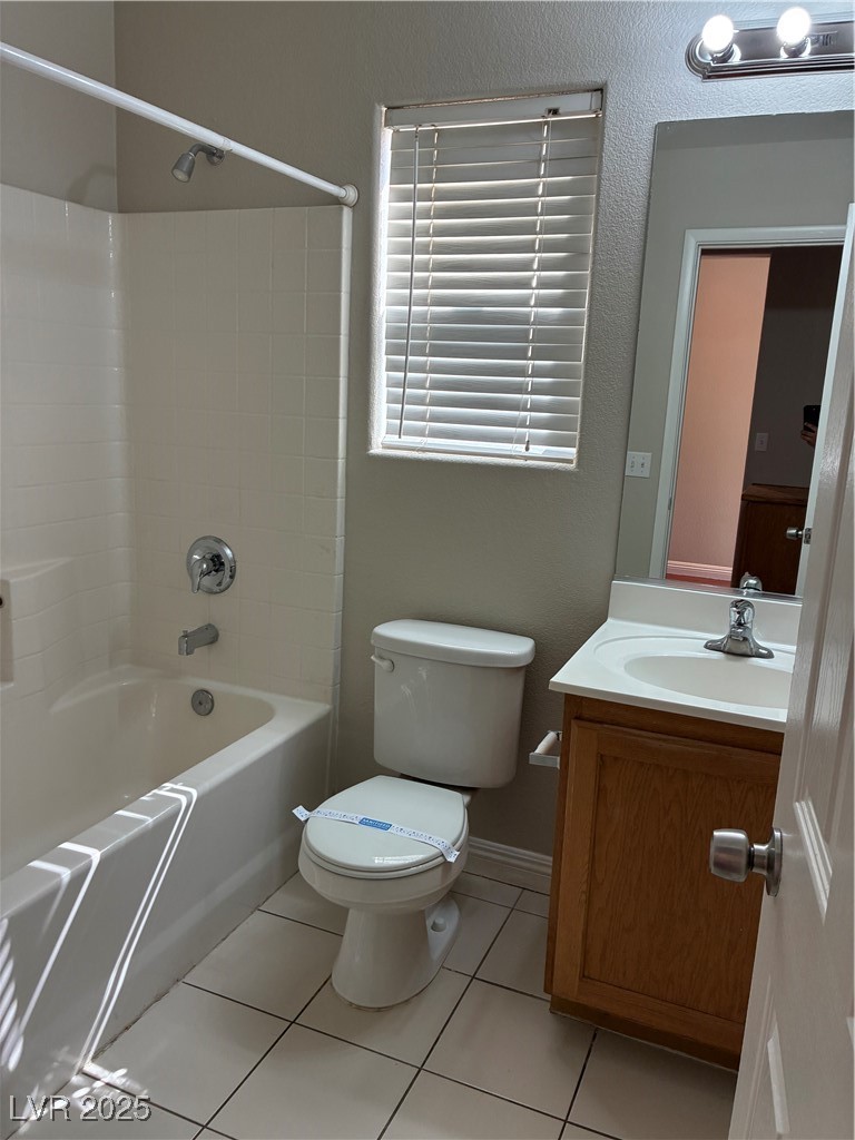 3346 Wasatch Cedars Street Las Vegas, NV 89122 - Photo 9 of 9 Full bathroom with washtub / shower combination, light tile patterned floors, and vanity