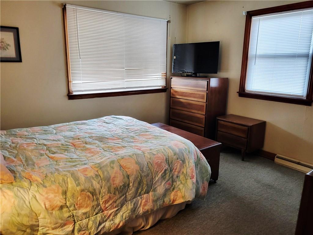 107 Wendel Road Herminie, PA 15637 - Photo 11 of 16 a bedroom with a bed and flat screen tv