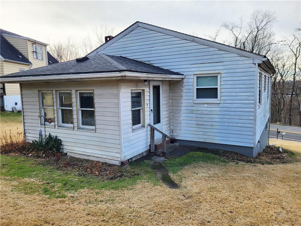 107 Wendel Road Herminie, PA 15637 - Photo 3 of 16 a front view of a house with garden