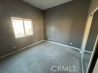 a bathroom with a sink mirror vanity and toilet
