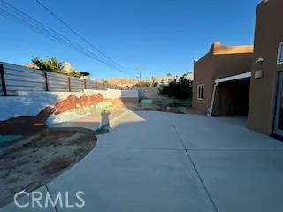 a kitchen with stainless steel appliances granite countertop a refrigerator a oven and a sink