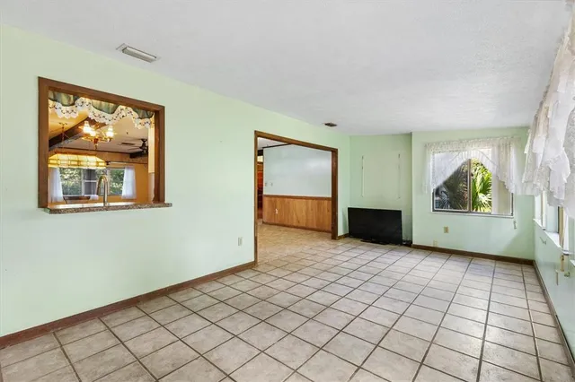 a view of a room with a large window