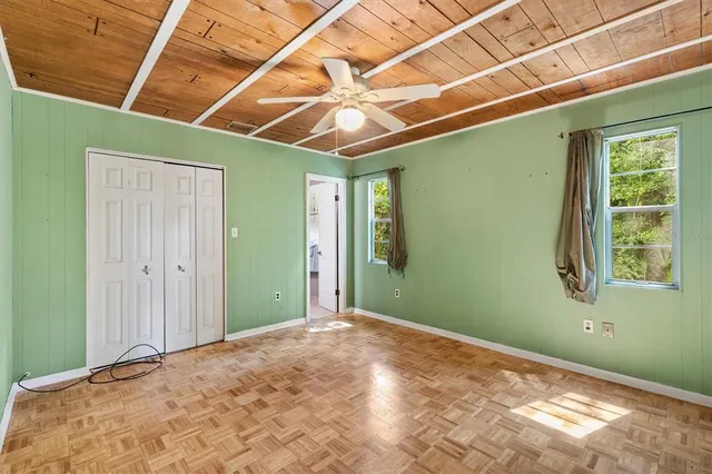 a view of a room with a projector and stairs