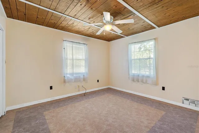 a bathroom with a sink double vanity granite tub shower and a mirror