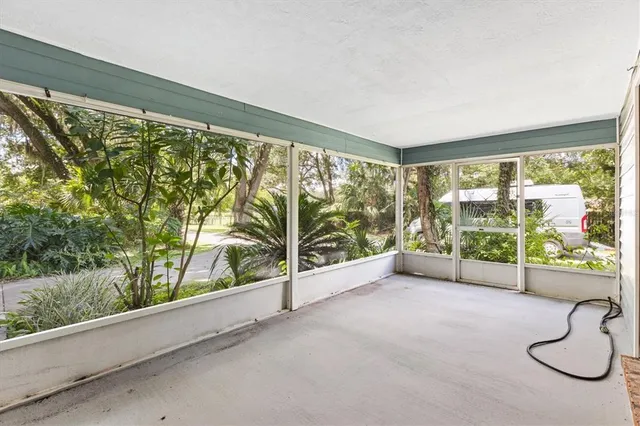 a view of an empty room and glass door