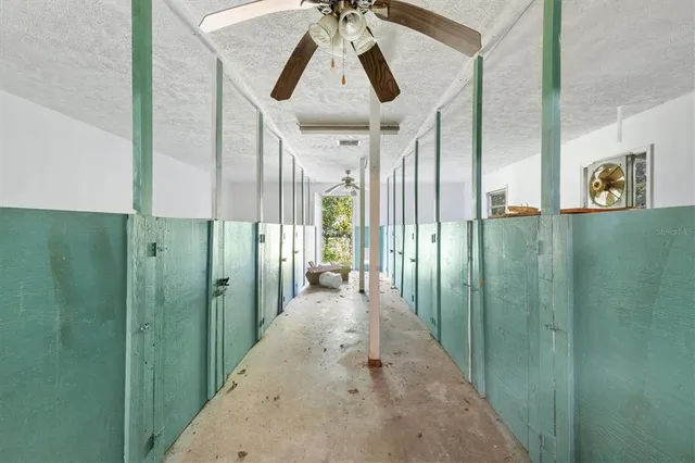 a bedroom with a bed and dresser with mirror