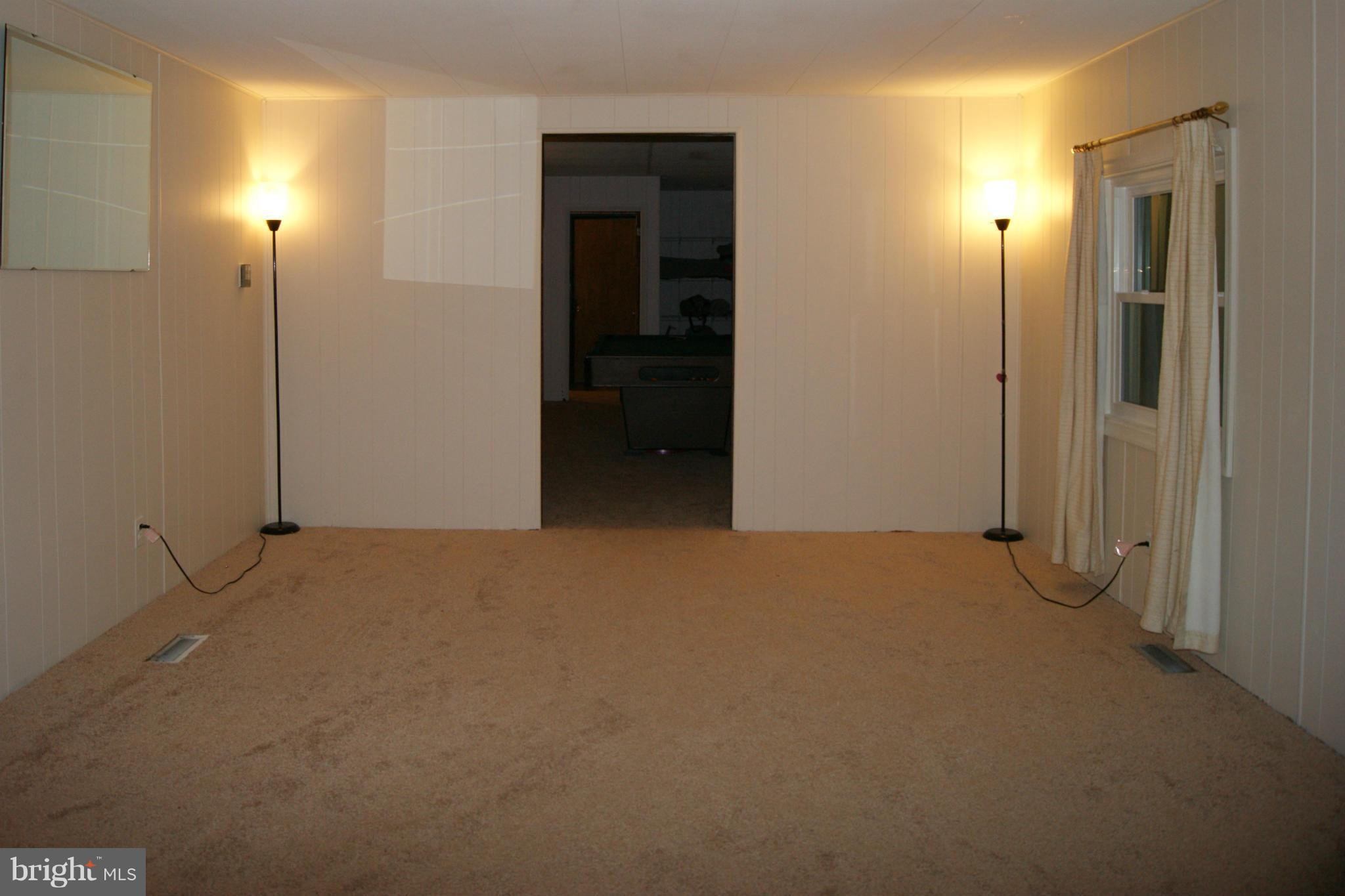 6805 Mackall Road St. Leonard, MD 20685 - Photo 14 of 30 an empty room with windows