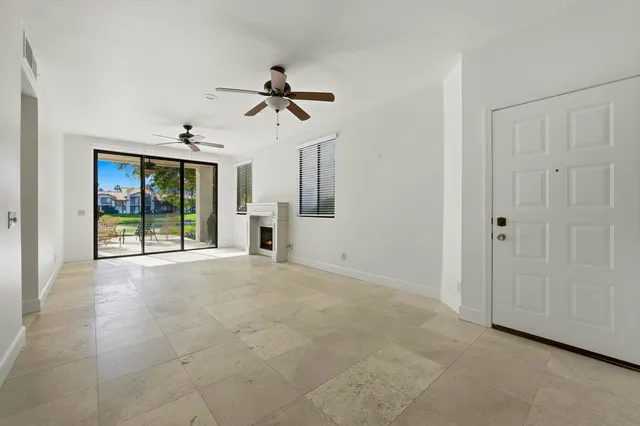 a view of empty room with windows