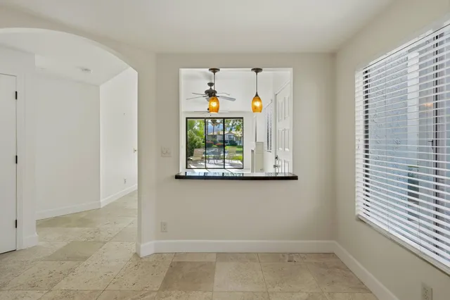 a view of room with window and ceiling fan