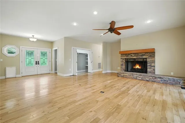 a kitchen with granite countertop a refrigerator stove and microwave