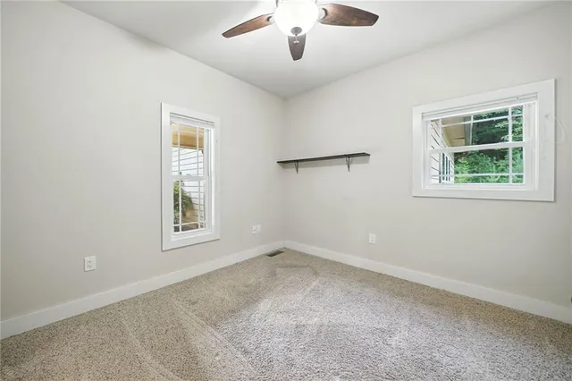 a view of a door and wooden floor