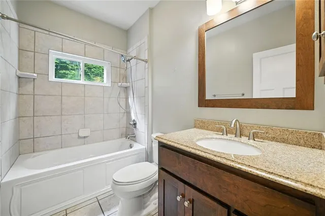 a kitchen with stainless steel appliances granite countertop a stove a sink and a granite counter tops