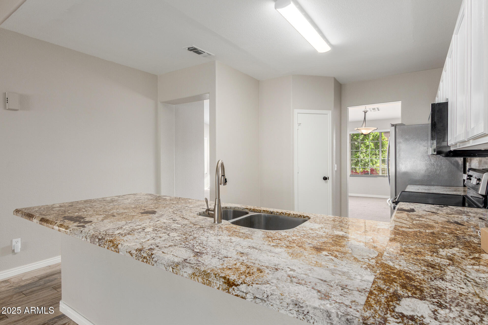 11232 East Dover Street Mesa, AZ 85207 - Photo 13 of 31 a bathroom with a granite countertop sink and a mirror
