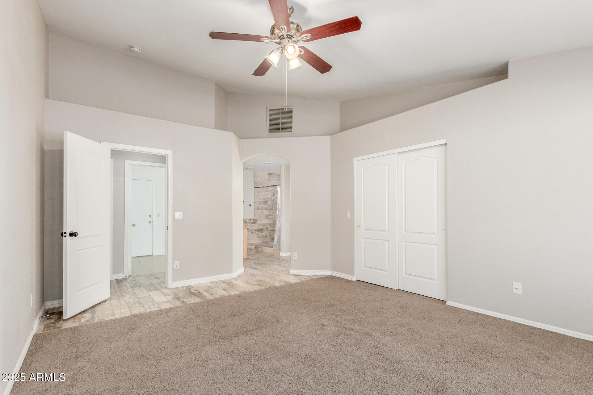 11232 East Dover Street Mesa, AZ 85207 - Photo 16 of 31 an empty room with closet and a ceiling fan