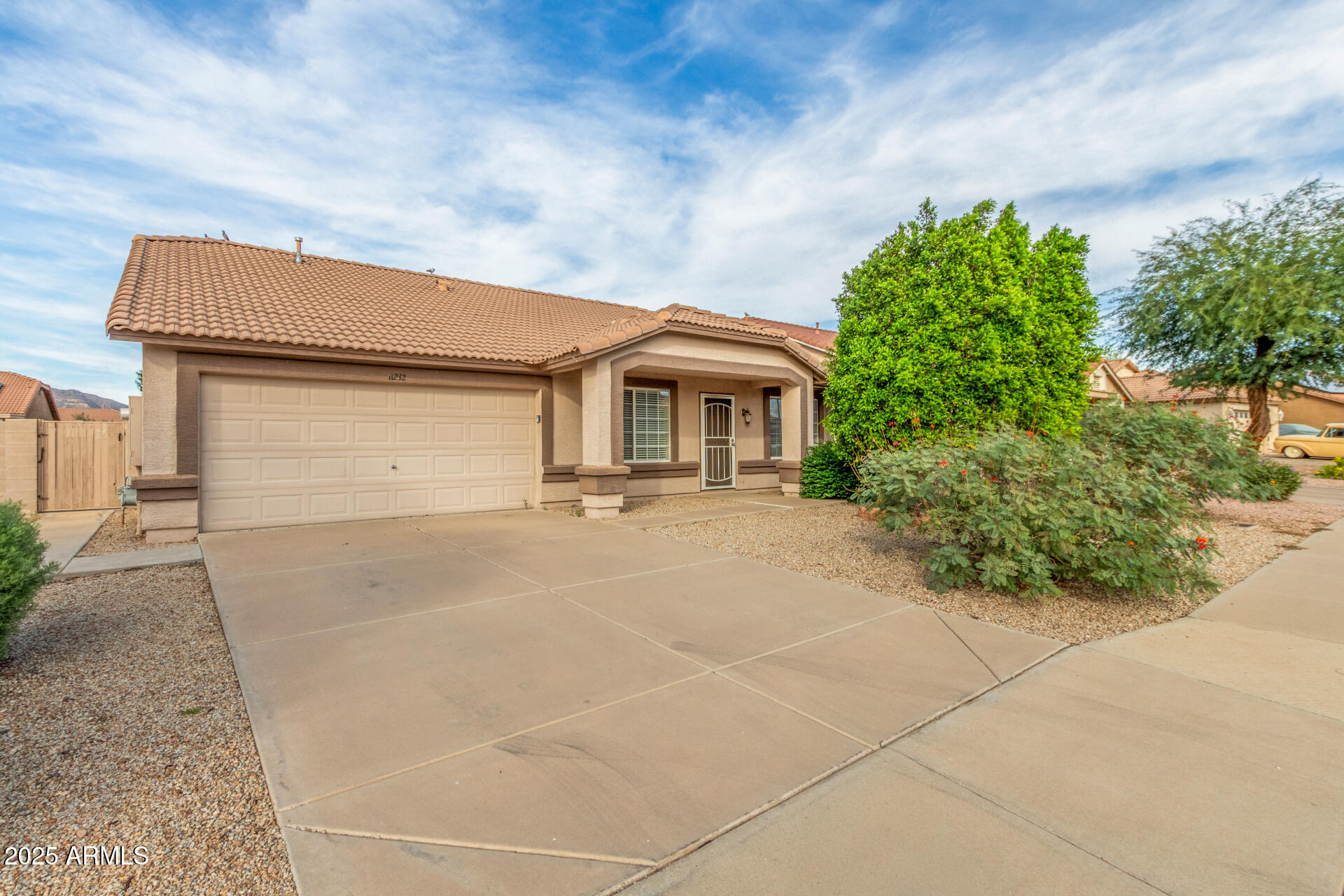 11232 East Dover Street Mesa, AZ 85207 - Photo 2 of 31 a front view of a house with a garden
