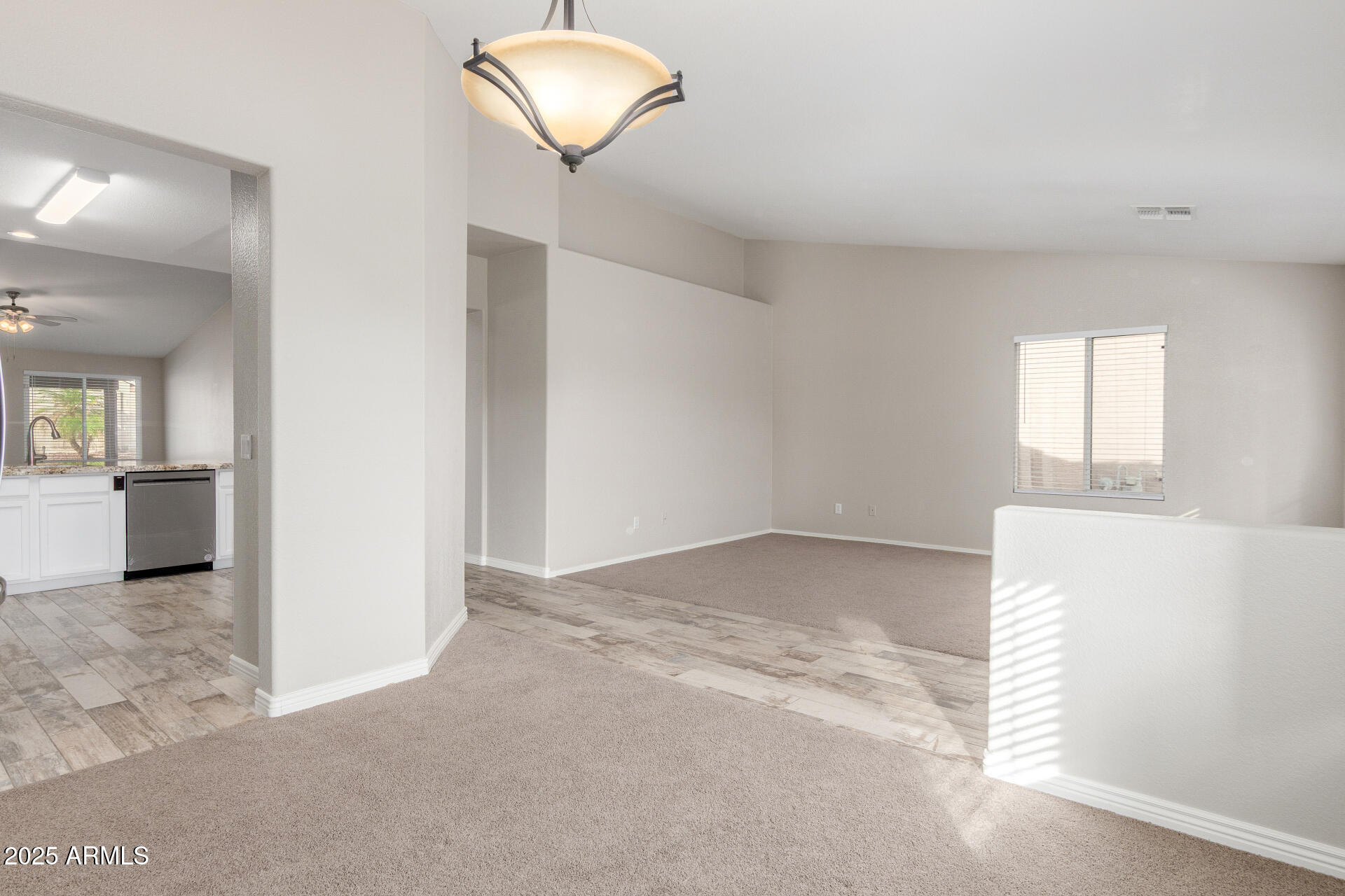 11232 East Dover Street Mesa, AZ 85207 - Photo 8 of 31 an empty room with windows and cabinet
