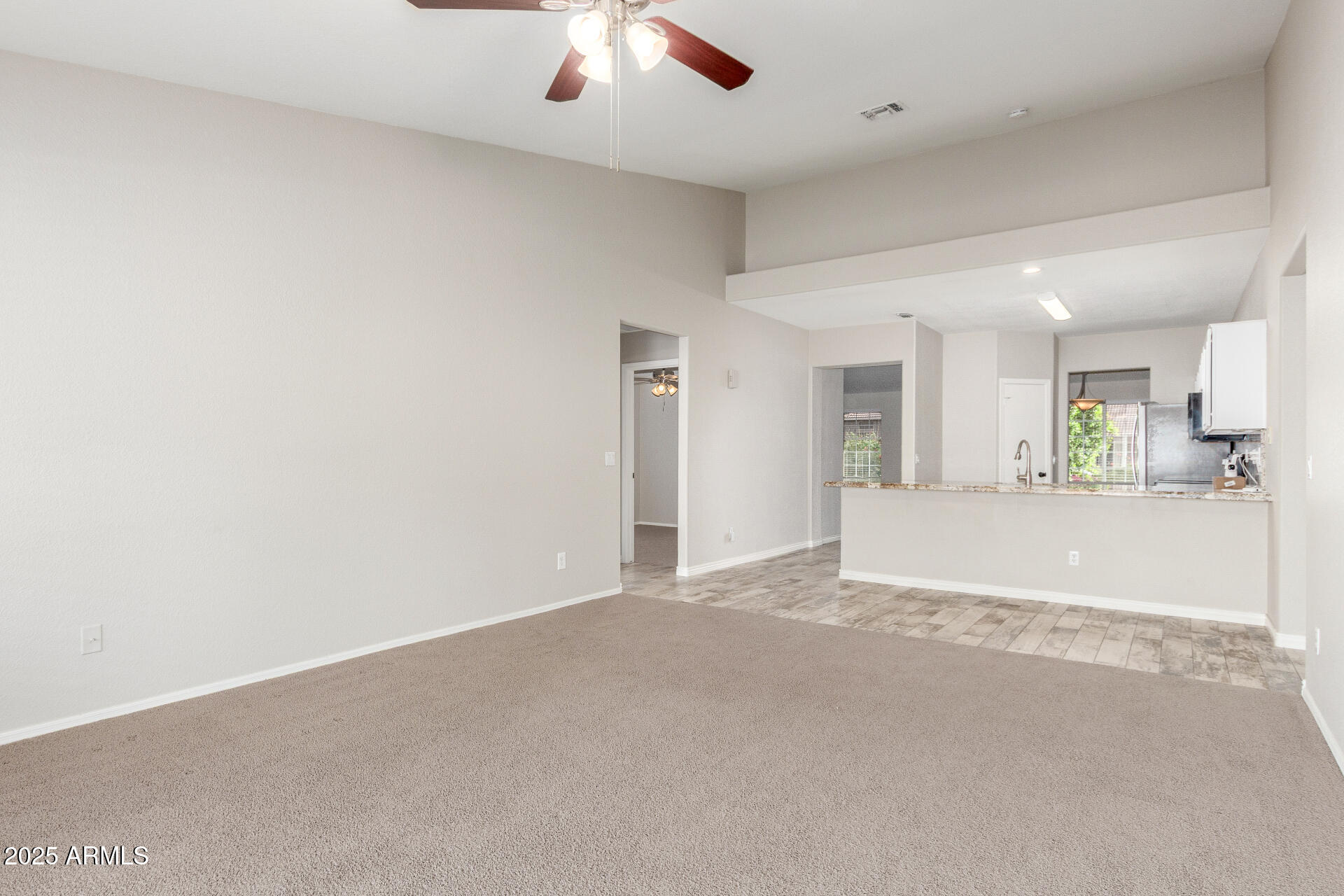11232 East Dover Street Mesa, AZ 85207 - Photo 10 of 31 an empty room with a empty space and windows