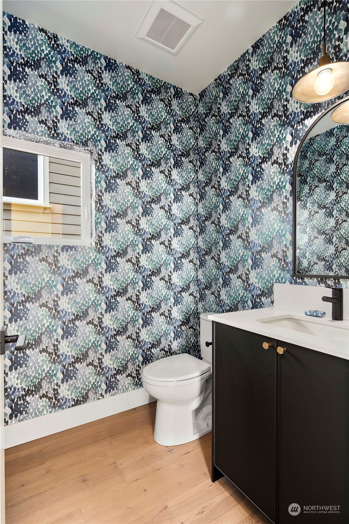 2308 North 38th Street Seattle, WA 98103 - Photo 14 of 40 a bathroom with a toilet and a sink
