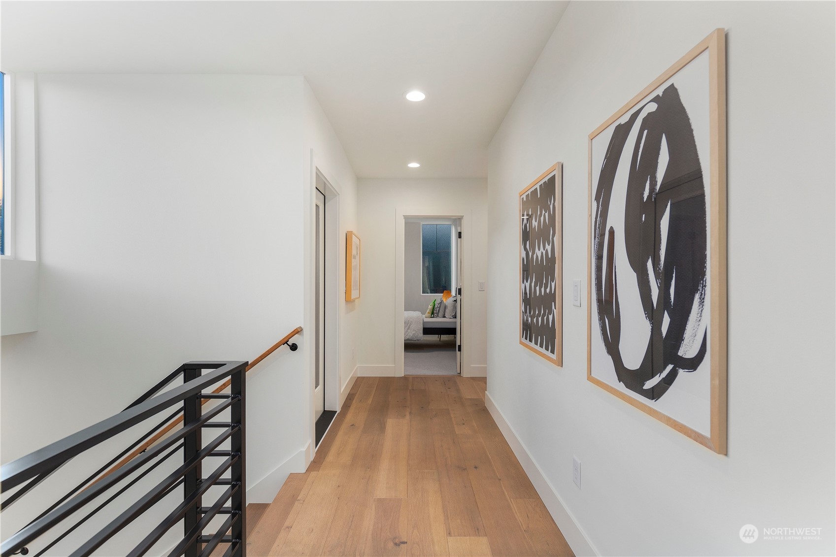 2308 North 38th Street Seattle, WA 98103 - Photo 19 of 40 a view of a hallway with wooden floor and staircase