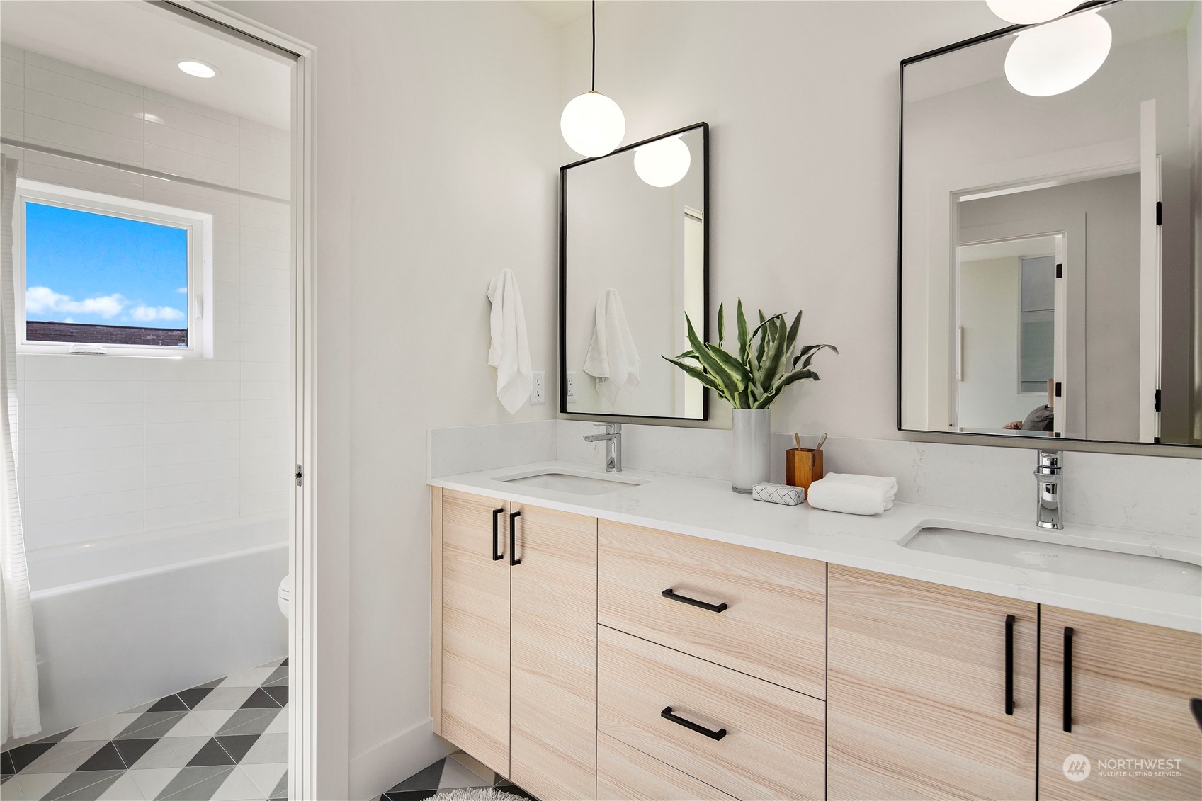 2308 North 38th Street Seattle, WA 98103 - Photo 23 of 40 a bathroom with a sink and a mirror
