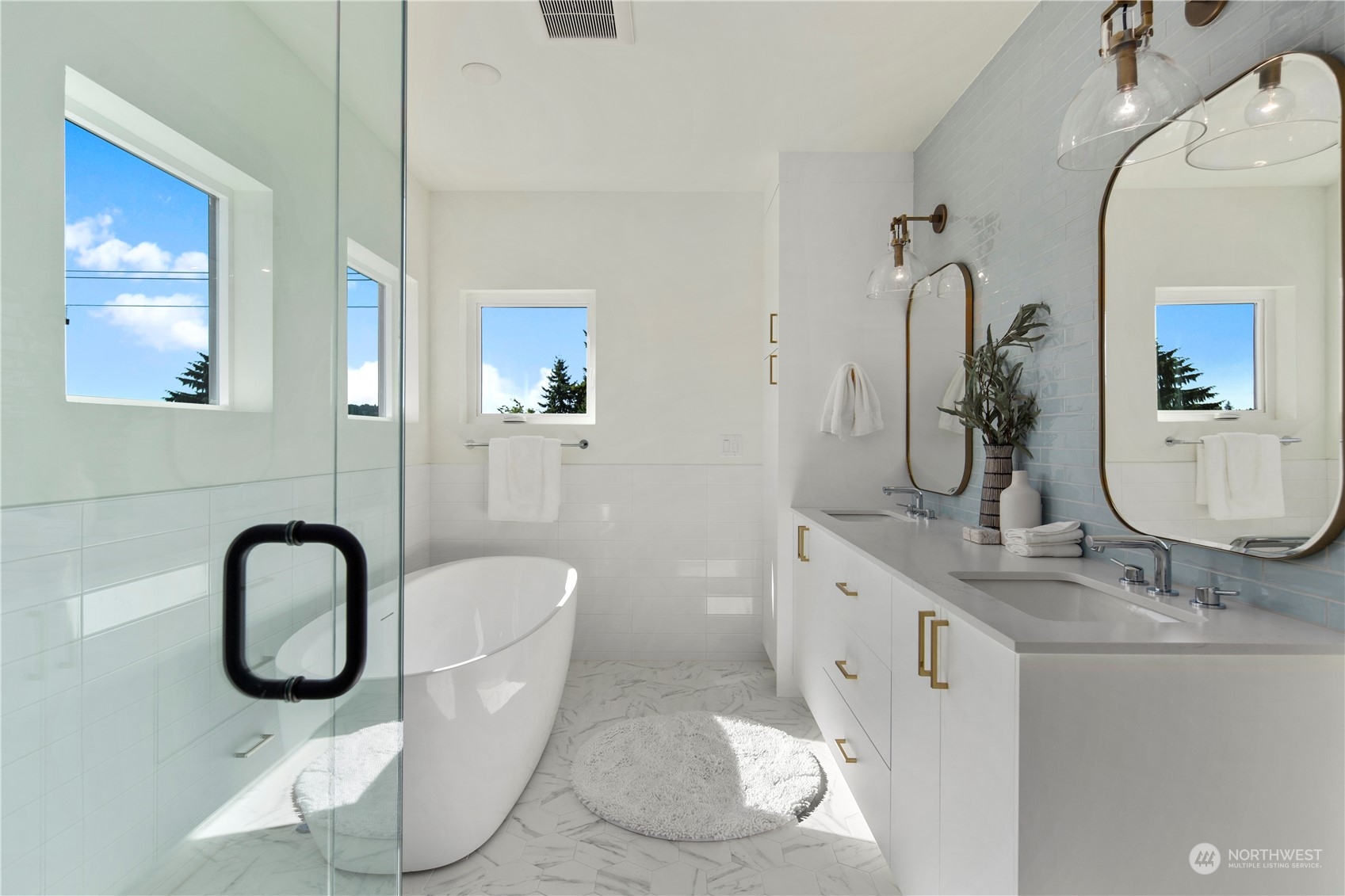 2308 North 38th Street Seattle, WA 98103 - Photo 24 of 40 a spacious bathroom with a granite countertop sink and a mirror