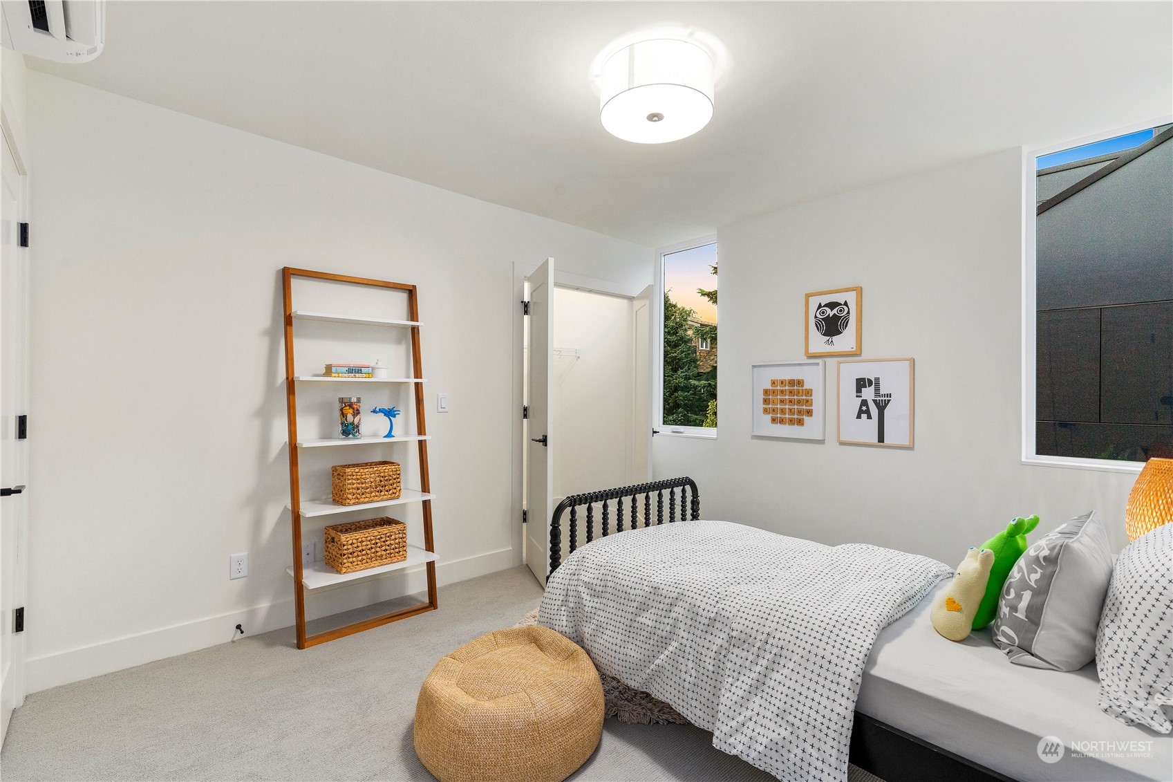 2308 North 38th Street Seattle, WA 98103 - Photo 27 of 40 a bedroom with a bed and a couch