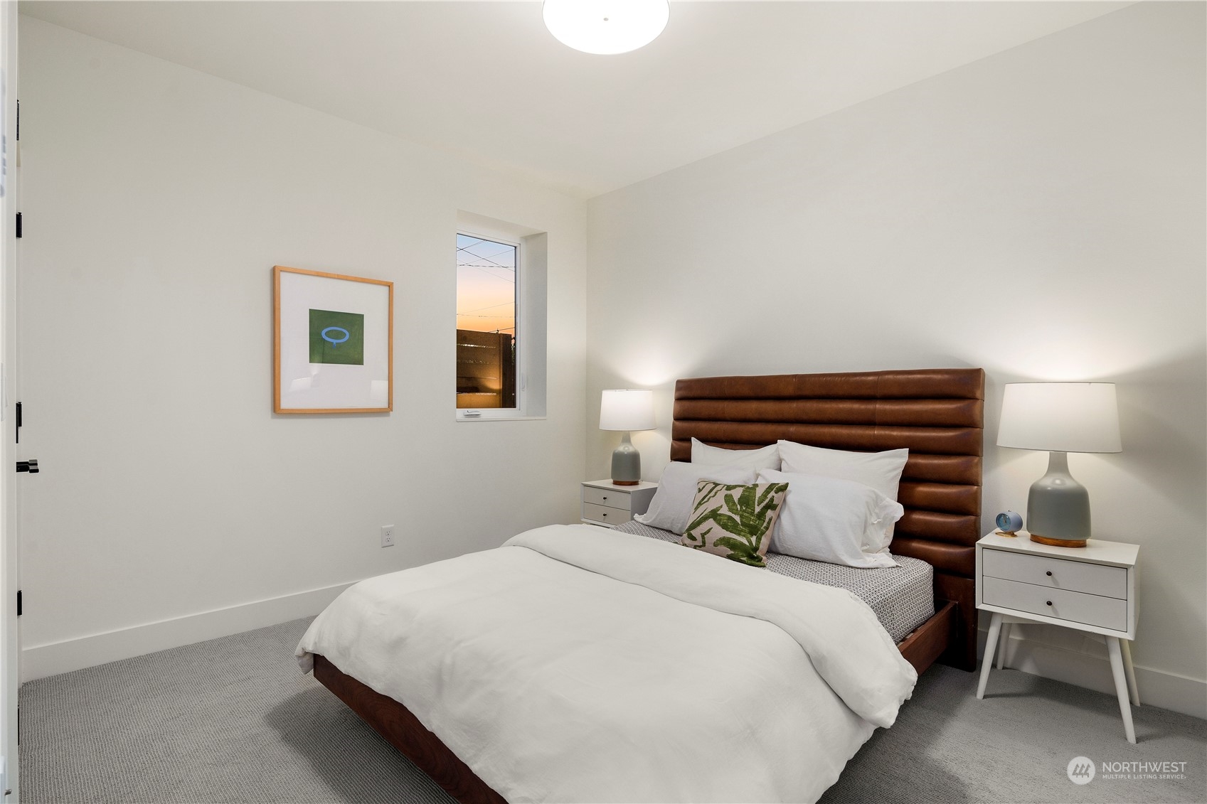 2308 North 38th Street Seattle, WA 98103 - Photo 32 of 40 a bedroom with a bed and a night stand