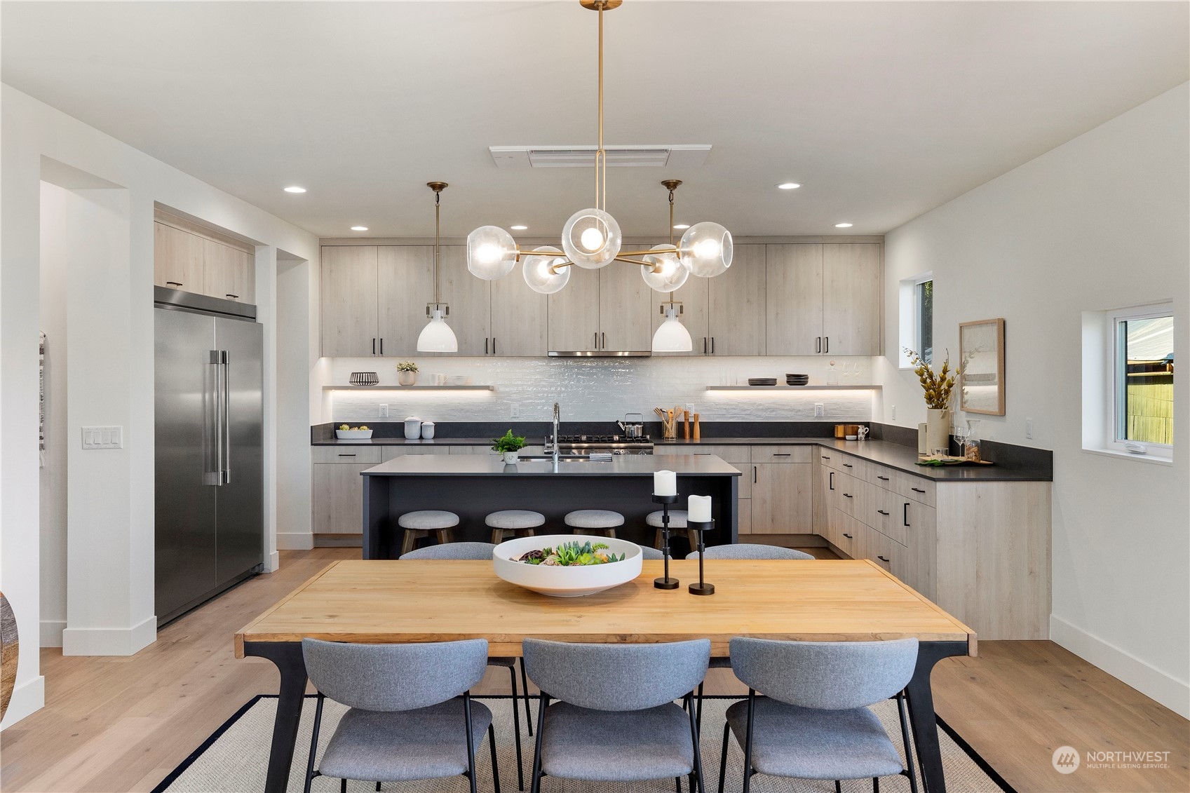 2308 North 38th Street Seattle, WA 98103 - Photo 5 of 40 a large kitchen with a table and chairs