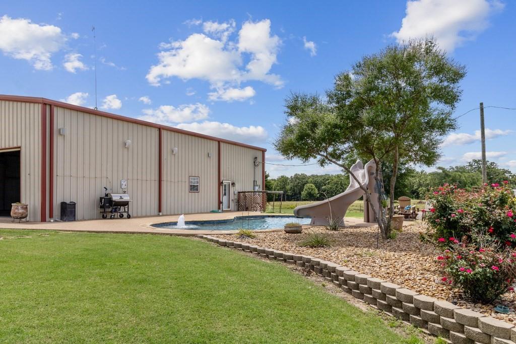 800 County Road 2807 Mabank, TX 75147 - Photo 7 of 40 a backyard of a house with yard and outdoor seating