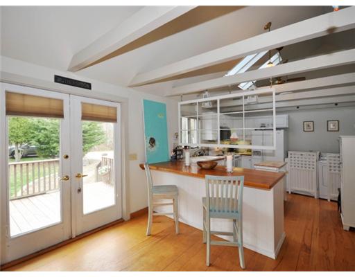 1403 North Main Road Jamestown, RI 02835 - Photo 3 of 12 Kitchen. Kitchen off deck with skylights and vaulted ceilings, exposed beams!