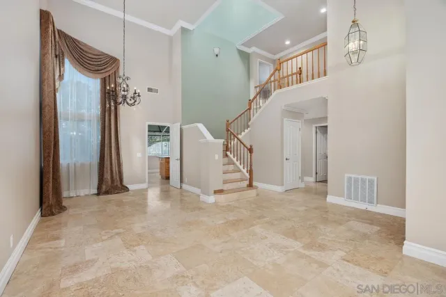 a view of an empty room with stairs