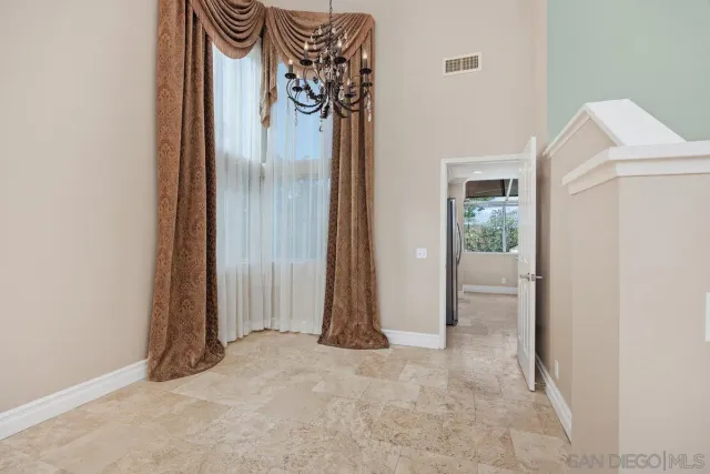 a view of a room that has a door and a closet