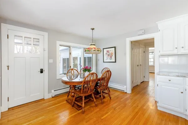 a dining room with furniture and window