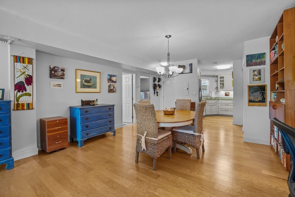 45 Main Street, Unit 112 Wareham, MA 02571 - Photo 8 of 30 a view of a livingroom with furniture and a chandelier