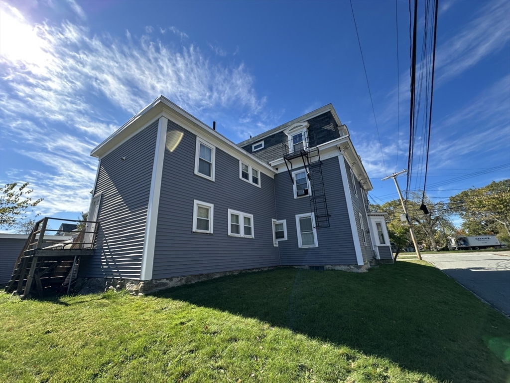 693 Concord Street Framingham, MA 01702 - Photo 14 of 19 a front view of a house with garden