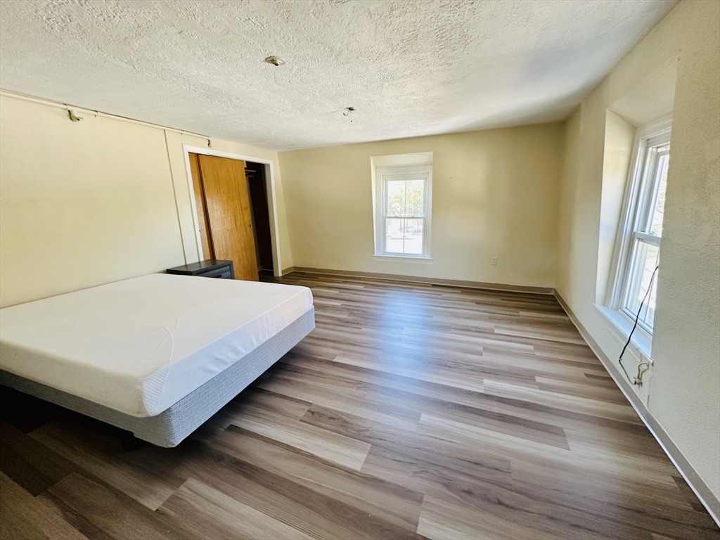 693 Concord Street Framingham, MA 01702 - Photo 5 of 19 a bedroom with a bed and window