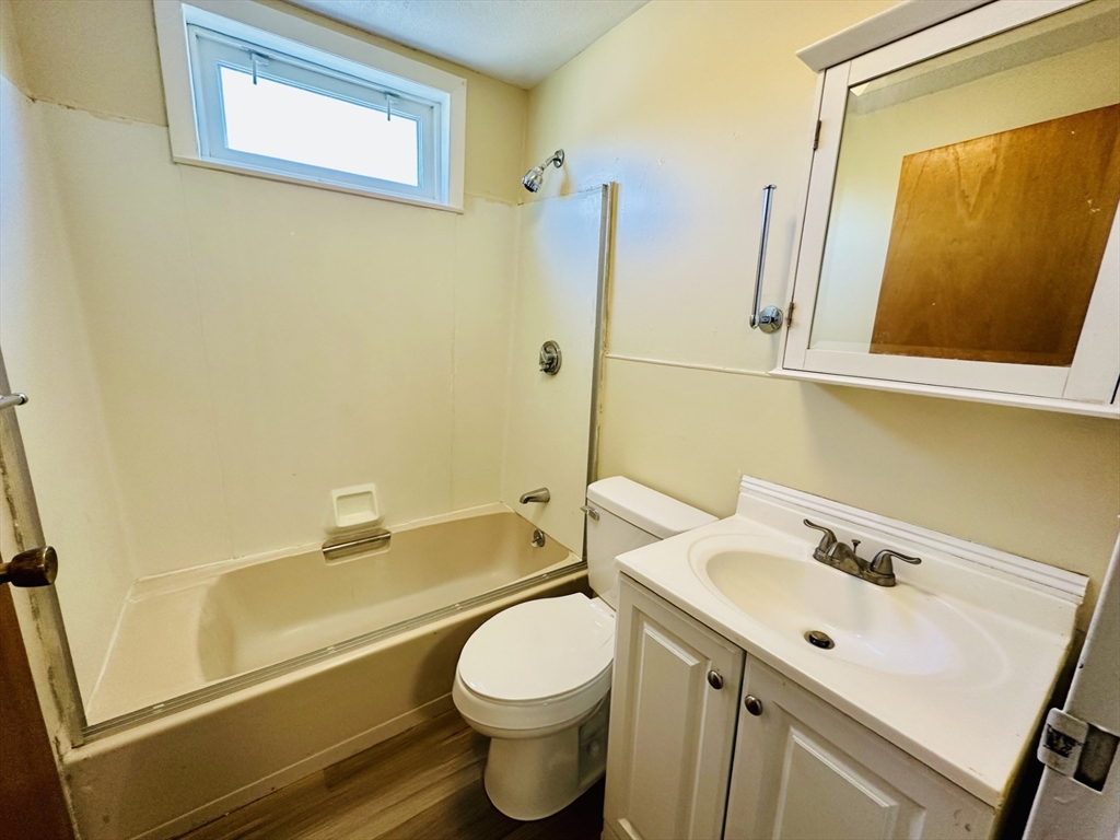 693 Concord Street Framingham, MA 01702 - Photo 6 of 19 a bathroom with a sink toilet and shower