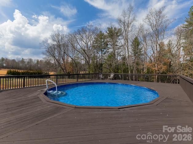 3131 Christie Road Hudson, NC 28638 - Photo 11 of 48 a view of a swimming pool with a yard