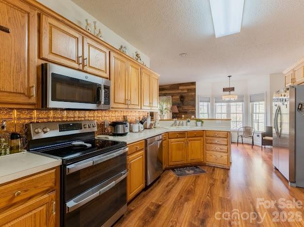 3131 Christie Road Hudson, NC 28638 - Photo 12 of 48 a kitchen with stainless steel appliances a stove sink microwave and cabinets