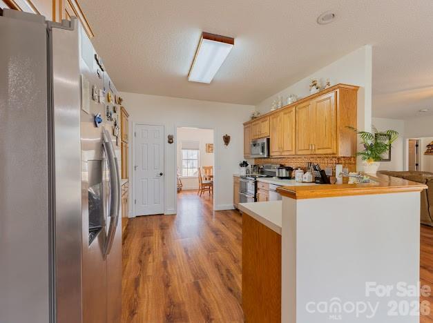 3131 Christie Road Hudson, NC 28638 - Photo 15 of 48 a kitchen with stainless steel appliances granite countertop a refrigerator a stove and a sink