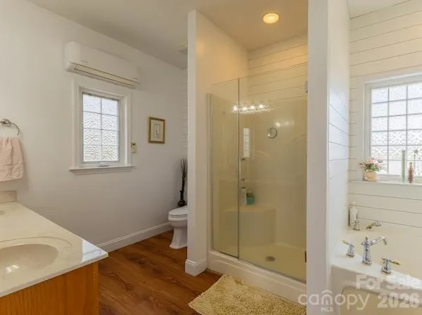 a bathroom with a bathtub and shower
