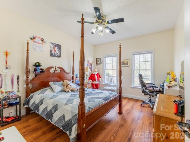 3131 Christie Road Hudson, NC 28638 - Photo 33 of 48 a bed room with a bed furniture and a chandelier