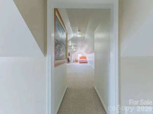 a view of a hallway with staircase
